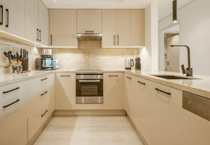 Coffee/tea maker, fridge, microwave, oven