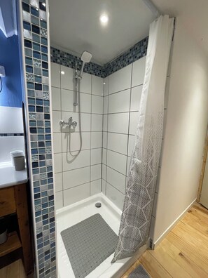 Shower, hair dryer, towels, soap