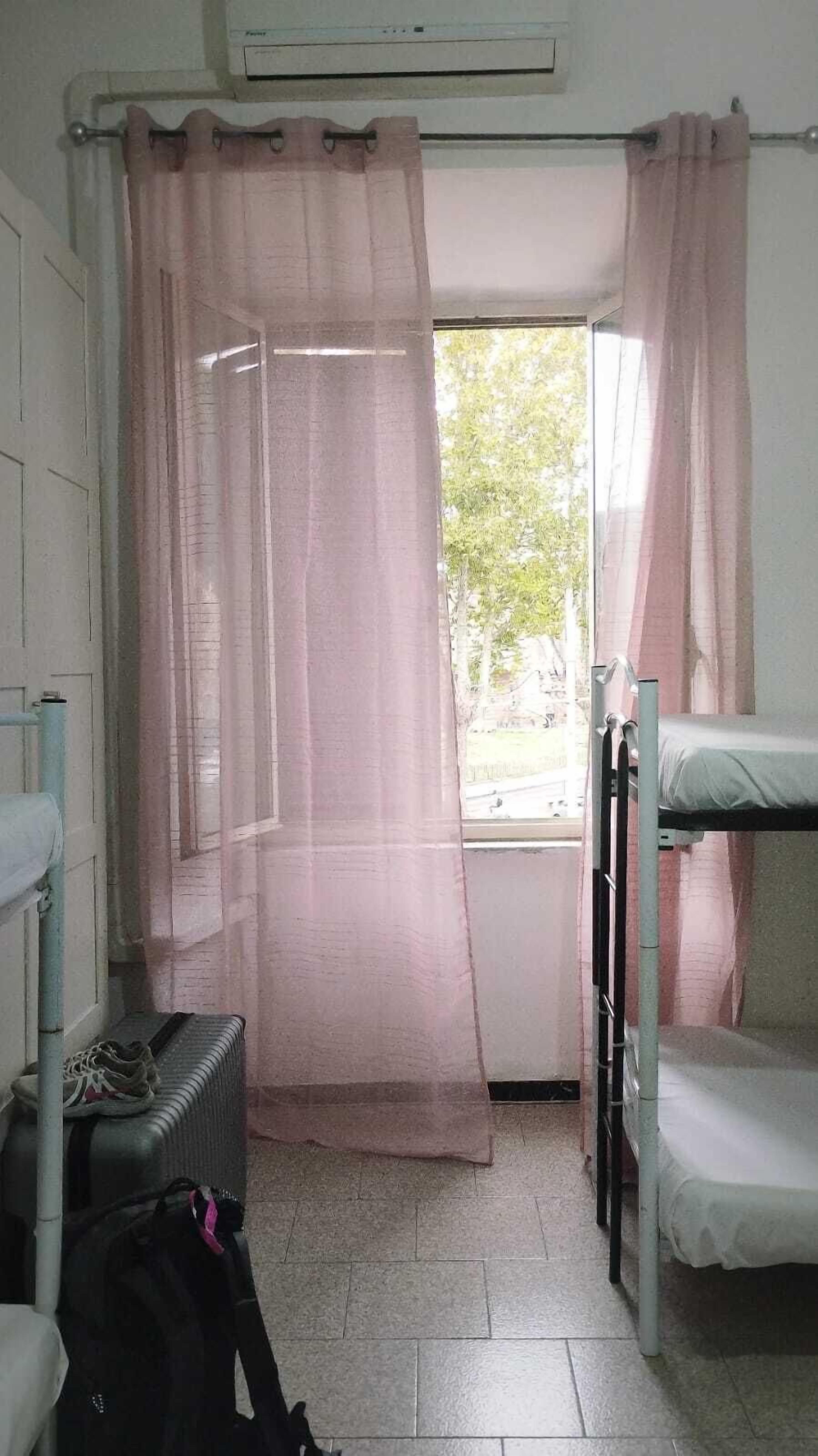Female Dorm Room with 6 Beds | Tabla de planchar con plancha y wifi gratis