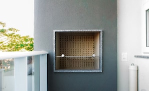 A modern bathroom with a built-in shower and a small window.