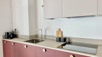 Stovetop, coffee/tea maker, cookware/dishes/utensils, dining tables