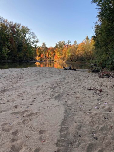Four-bedroom house with private Saco River access to white sand beach.