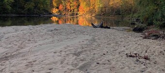 Four-bedroom house with private Saco River access to white sand beach.