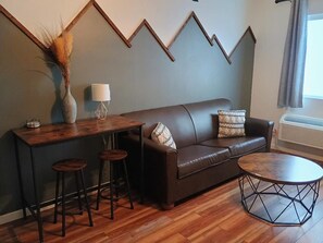 Deluxe Suite, Mountain View | Living area | 60-inch Smart TV with digital channels