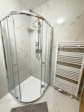 Shower, hair dryer, towels, soap