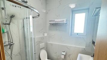 Shower, hair dryer, towels, soap