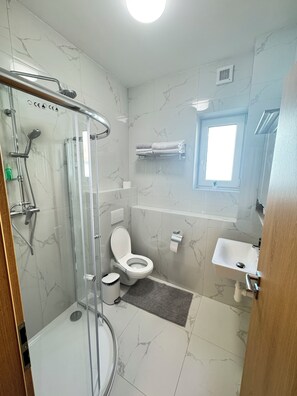 Shower, hair dryer, towels, soap