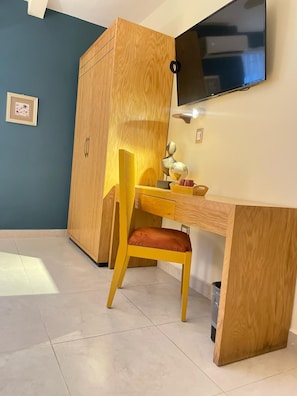 Desk, laptop workspace, blackout drapes, iron/ironing board