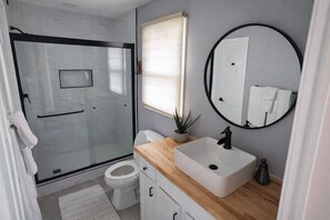 Shower, hair dryer, towels, soap
