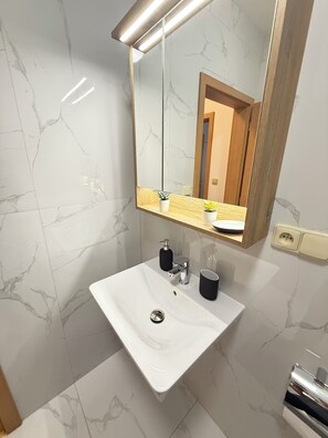 Shower, hair dryer, towels, soap