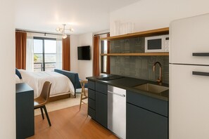Deluxe Room, 1 King Bed, Kitchenette | Iron/ironing board, free WiFi