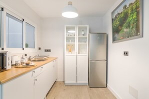 Fridge, microwave, stovetop, coffee/tea maker