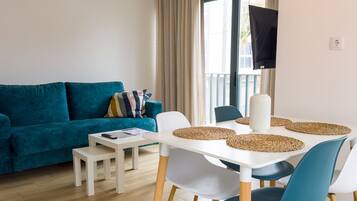 Apartment, 1 Bedroom, Balcony | Living area | TV