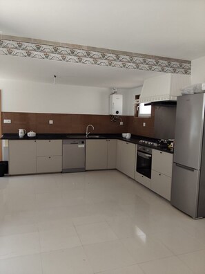 Fridge, coffee/tea maker, electric kettle, toaster