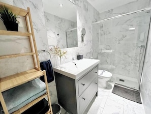 Shower, hair dryer, towels, soap
