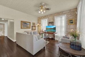 House, Multiple Beds, Patio, City View (101 N Orange #2) | Living area - Charming Balcony Suite Overlooking Main Street-walk to Everything! (Fredericksburg)