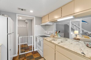 Condo, Multiple Beds, Pool Access, City View (101 Cove West #205) | Private kitchen | Fridge, microwave, oven, stovetop