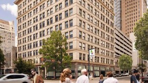 A multi-story hotel with a classic architectural design, featuring a symmetrical facade and numerous windows. - Studio 613 at The Frank (Birmingham)