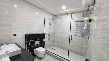 Shower, slippers, towels, soap