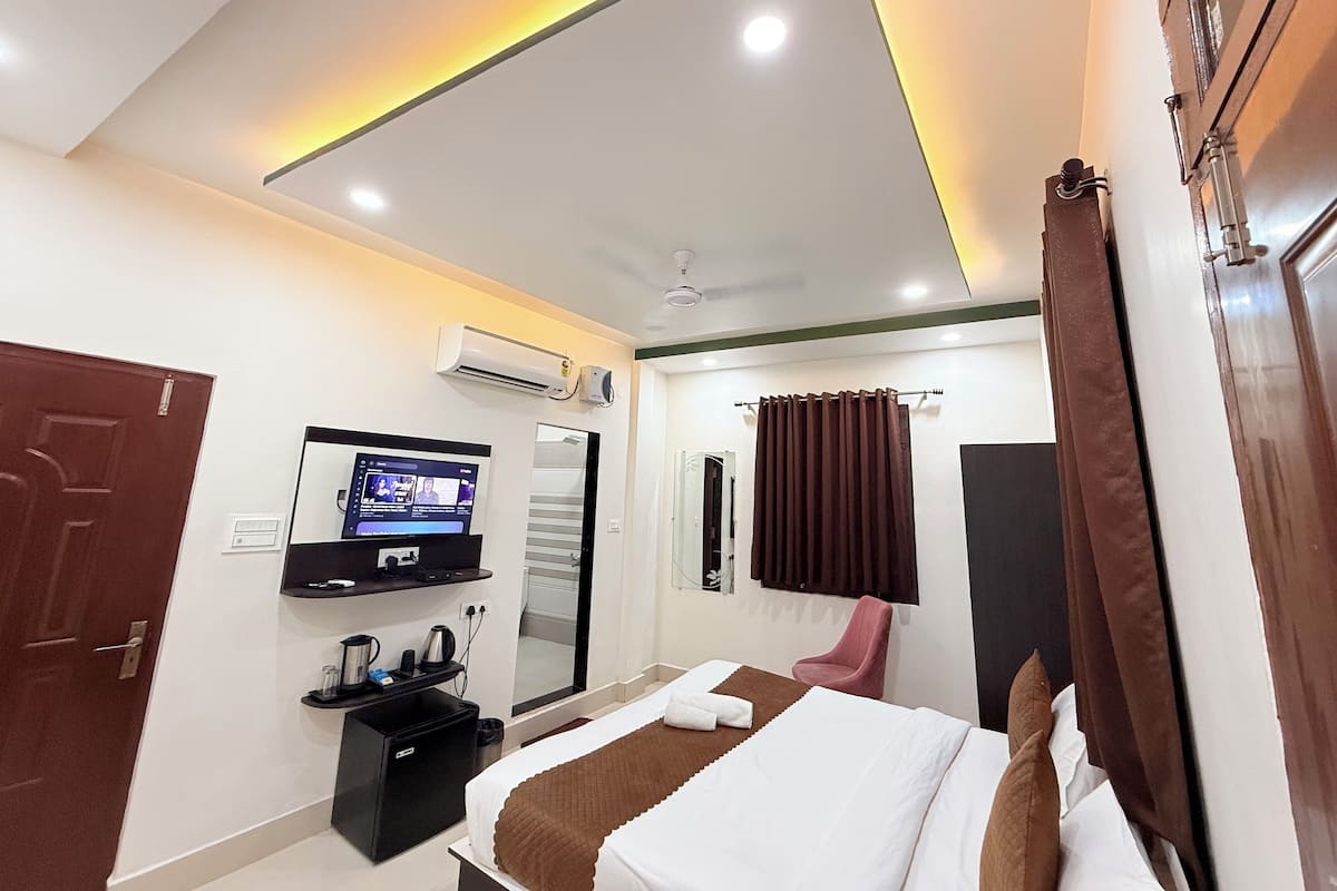 Chambre exécutive double, vue sur la ville | Espace de travail pour ordinateurs portables, fer et planche à repasser
