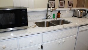 A kitchen with a microwave, sink, and toaster. - [Townhome] - El Fuerte (Riverdale)