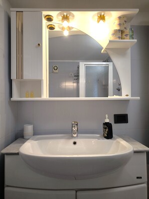 Shower, bathrobes, towels, soap