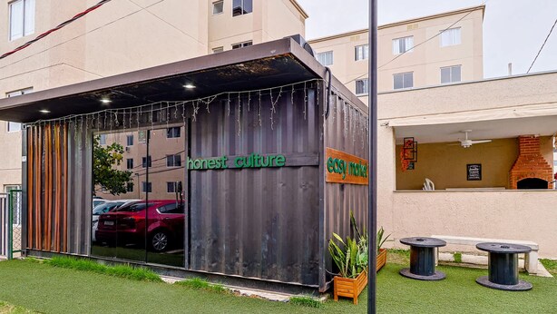 A modern building with a sign reading "honest culture" and "easy market".