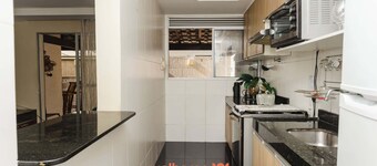 Apartamento em Campos com quintal e churrasqueira