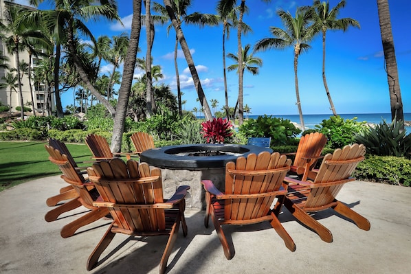 A patio with Adirondack chairs, a fire pit, and a view of the ocean. - Marriott's Ko Olina Beach Club, one bedroom with kitchen and full resort access (Kapolei)