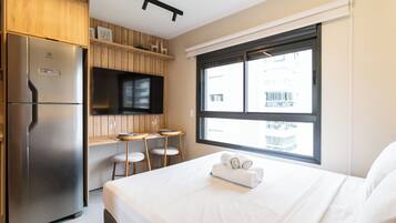 Estúdio | Roupas de cama premium, cortinas blackout, ferros/tábuas de passar roupa