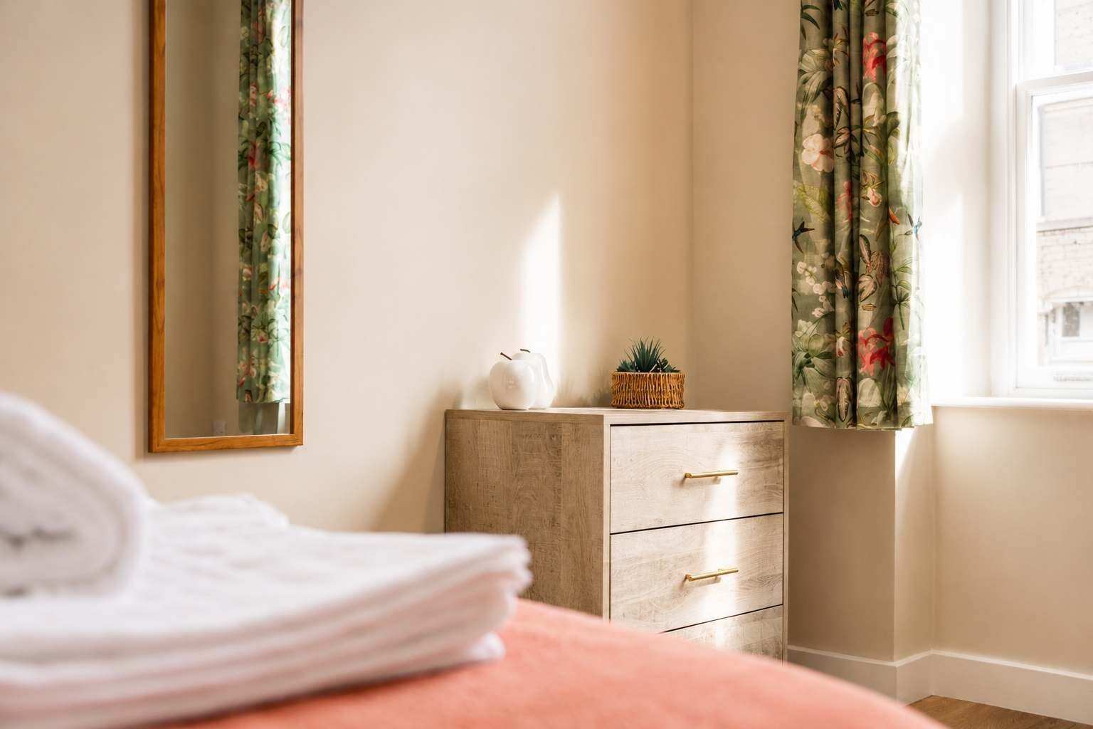 A peaceful retreat featuring a double bed dressed in soft linen for a restful night's sleep. The space offers a clean and comfortable setting designed to help you recharge.