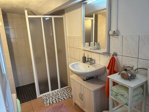 Shower, hair dryer, towels, soap