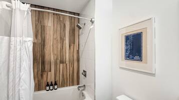 Shower, hair dryer, towels, shampoo