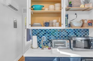 Microwave, coffee/tea maker, cookware/dishes/utensils