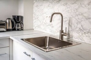 Microwave, coffee/tea maker, toaster, cookware/dishes/utensils