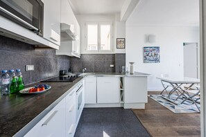 Fridge, dishwasher, cookware/dishes/utensils, dining tables