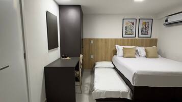 Basic Studio | Desk, blackout drapes, iron/ironing board, travel crib