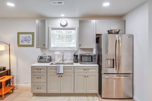 Fridge, microwave, stovetop, coffee/tea maker