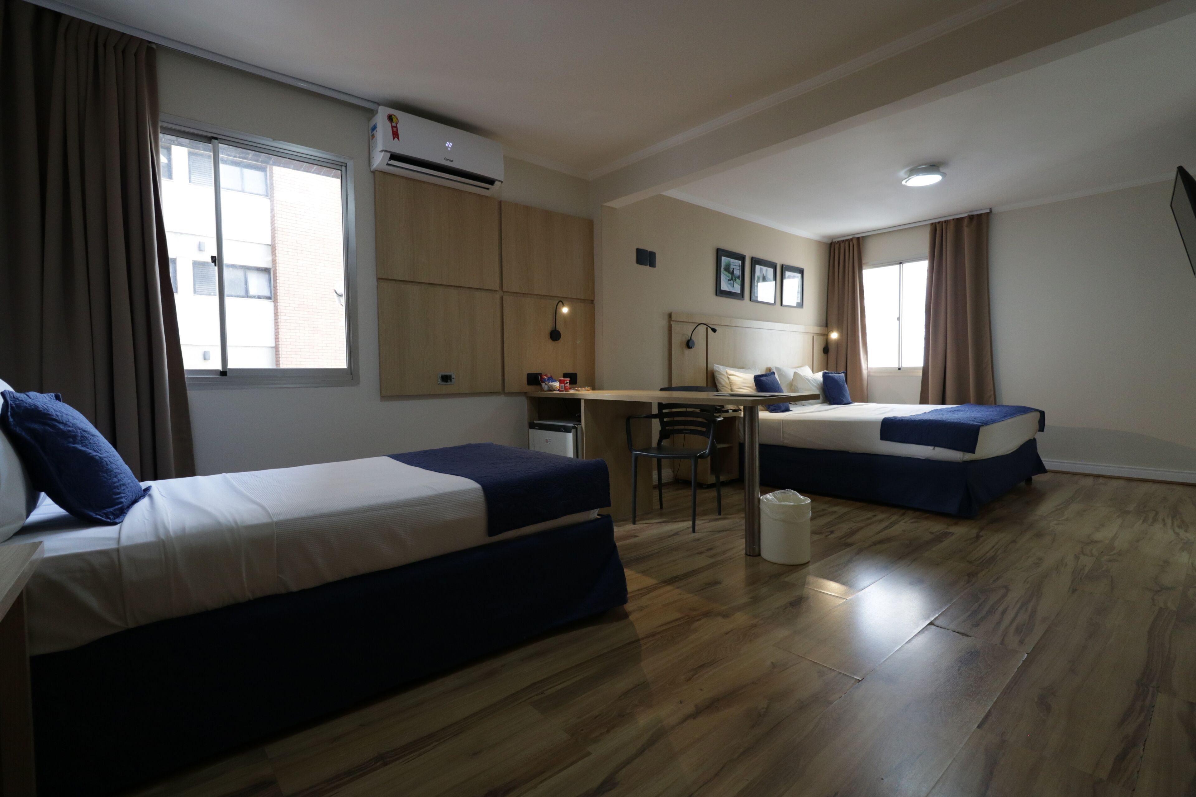 Deluxe Triple Room, City View | Minibar, laptop workspace, free WiFi, bed sheets