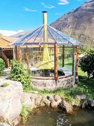 Intimate romantic retreat in the Sacred Valley with waterfall and mountain views