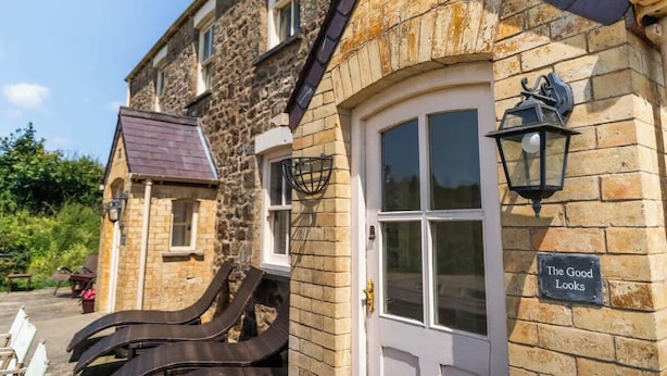 A stone building with a sign that reads "The Good Looks." - Charming Rural Escape with Play Room BBQ (Llawhaden)