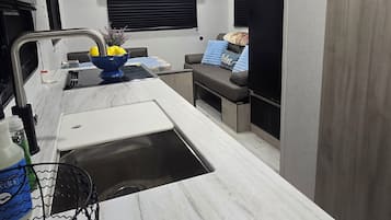 Fridge, microwave, stovetop, coffee/tea maker