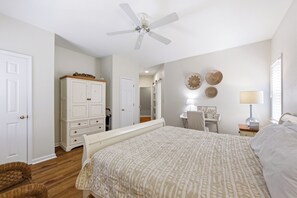 A bedroom with a bed, a desk, a chair, a wardrobe, a ceiling fan, and a window with blinds. - Coast to Coast:Dog Friendly, Private Pool, Hot Tub, Community Amenities (Corolla)