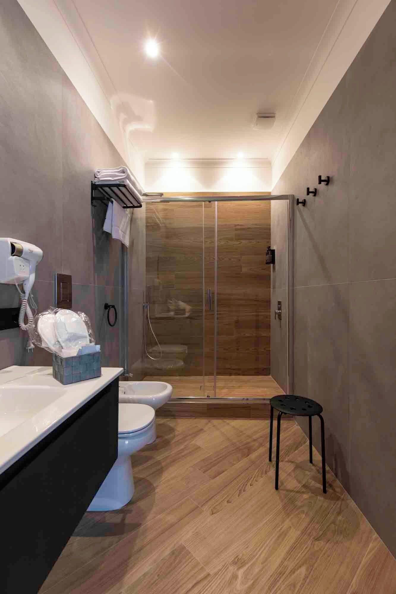 Family Double Room, City View | Bathroom | Hair dryer, slippers, towels, soap