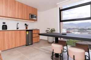 Mini-fridge, microwave, oven, stovetop