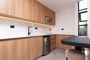 Mini-fridge, microwave, oven, stovetop