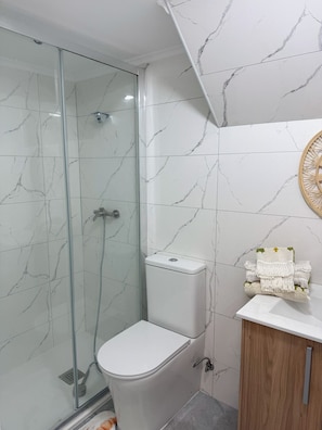 Shower, hair dryer, towels, soap