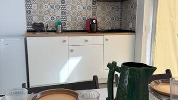 Fridge, microwave, stovetop, coffee/tea maker