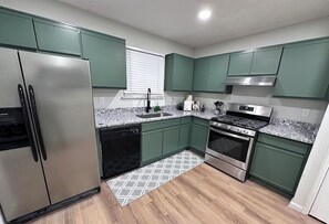 Microwave, oven, stovetop, dishwasher - Retreat at Stone Mountain – Cozy 3BR Near Trails, MARTA & Downtown (Stone Mountain)