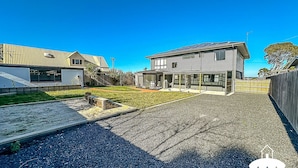 A modern two-story house with a covered patio and a gravel driveway. - Fishermans Stay at Port Franklin (Port Franklin)